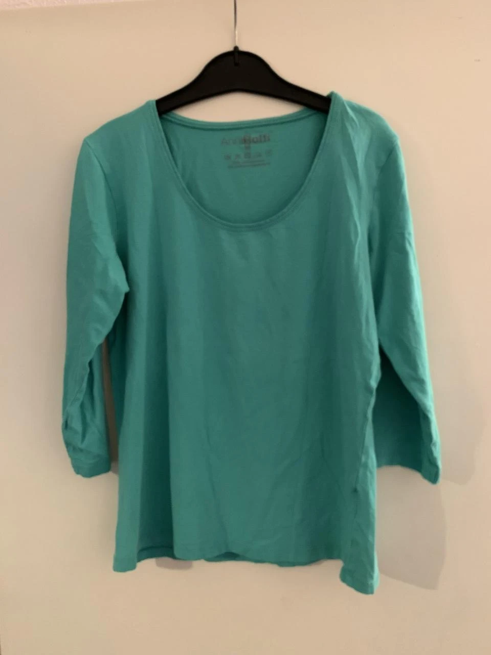 Mintgroene shirt van Anni Rolfi. Maat M.